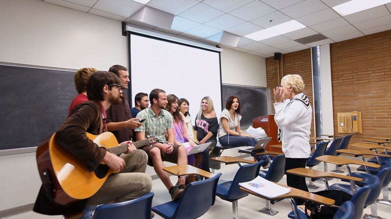 Photo of students celebrating in a classroom